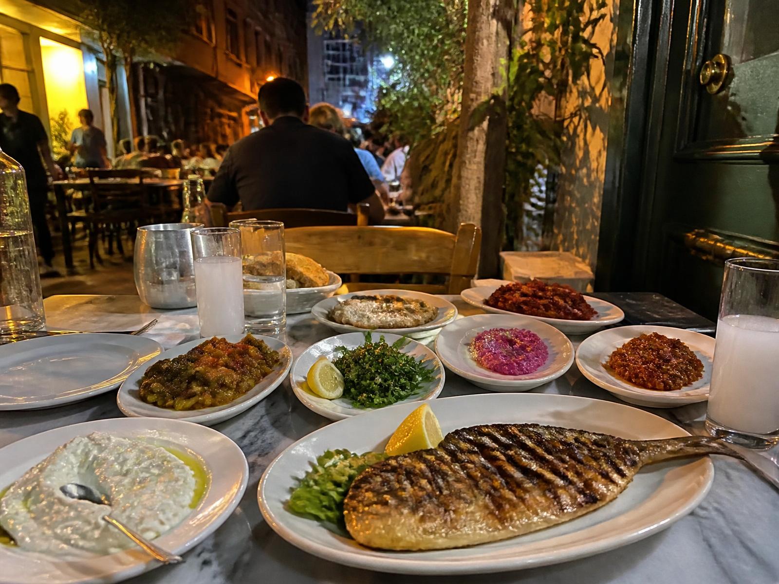 An Istanbul meyhane table of meze in the evening